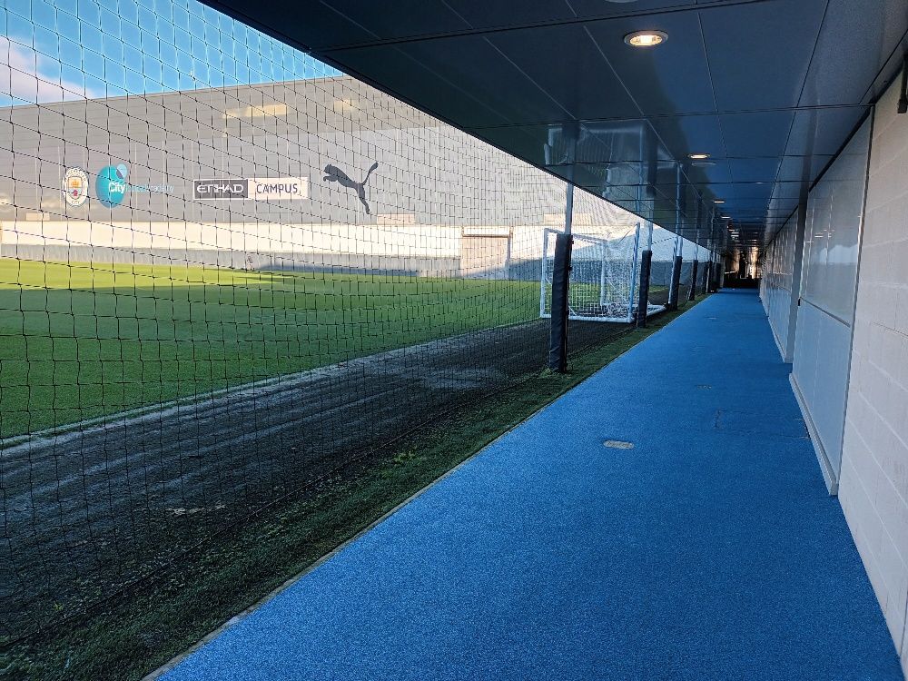 Manchester City Football Club, Etihad Campus, first team corridor leading to the pitch. Wet pour safety surfacing